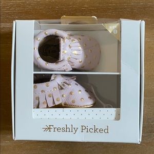 Size 0 pink Moccasin crib shoes. New in box.